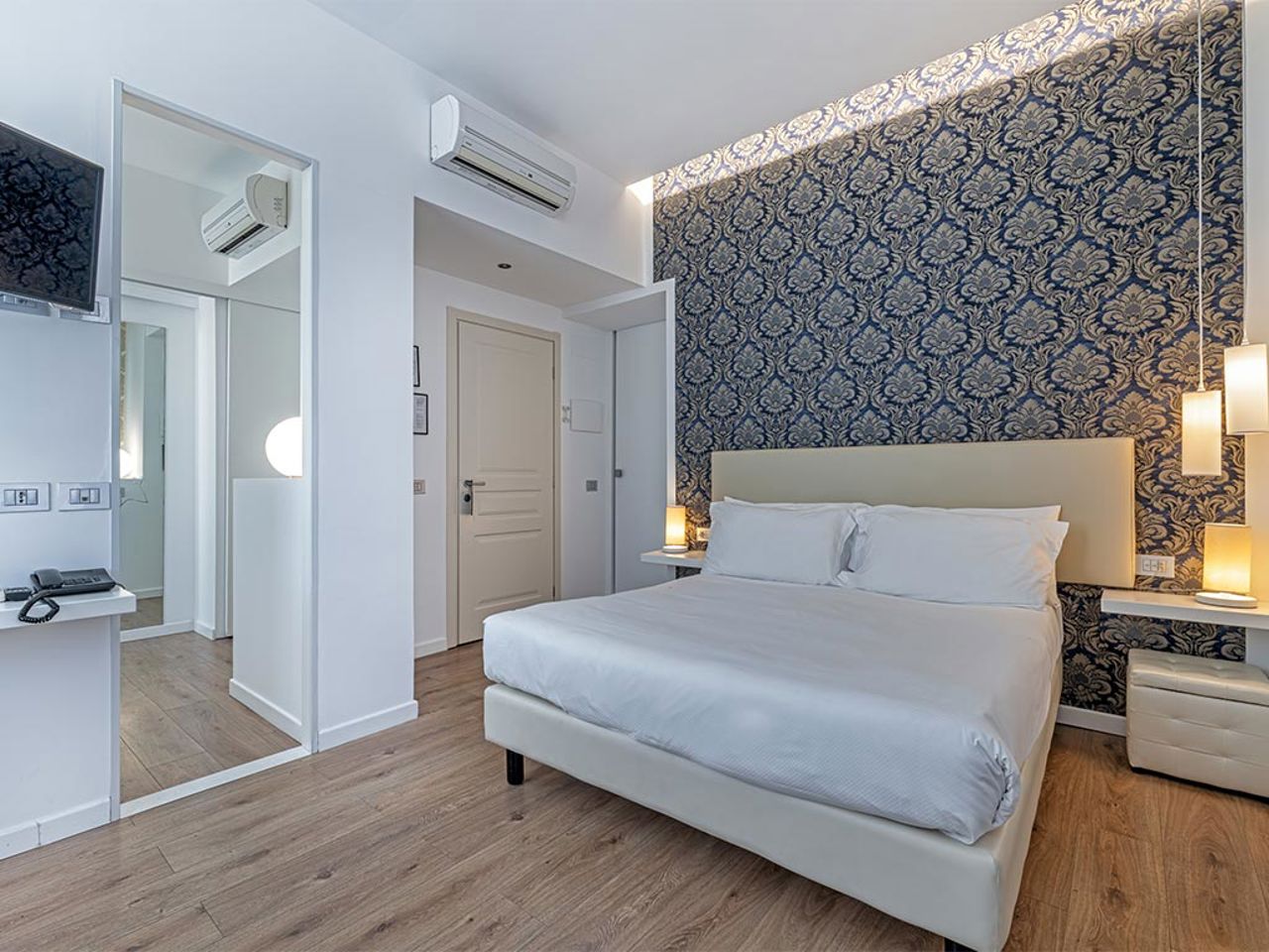 camera-tripla-comfort-di-sanremo-luxury-suites
