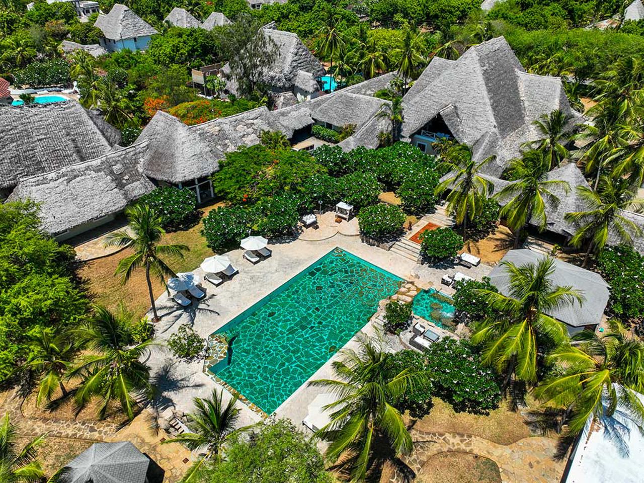 Aerial view of Flavio Briatore’s Lion in the Sun luxury resort in Malindi, Kenya, featuring villas, tropical gardens, and a large pool.