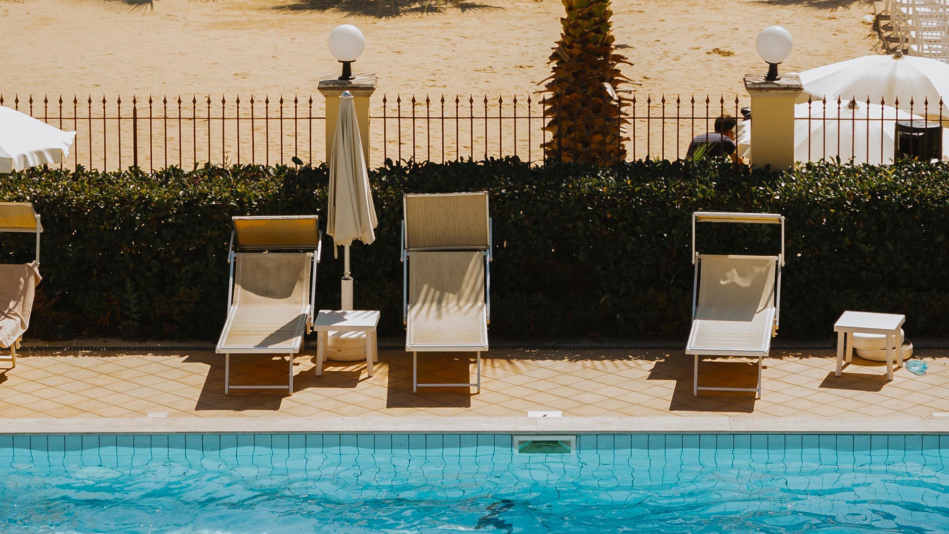 Outdoor swimming pool for guests with pool bar service 5