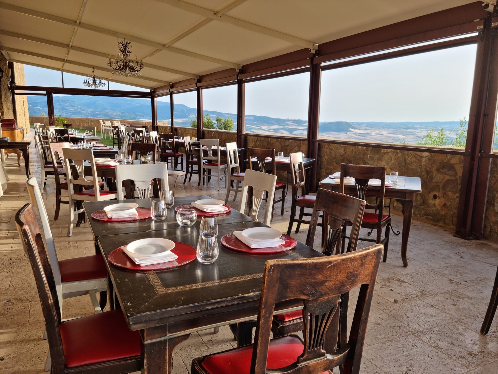A dining room opening onto the panoramic terrace of Castello di Velona